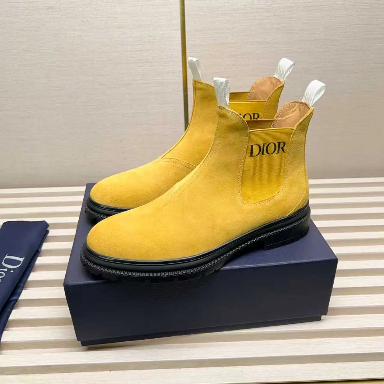 Men's Shoes 💰480 Dior A practical choice that combines protection with classic style. Made from durable Rugged Calf leather, it's tumbled and hand-finished to create a soft suede feel with a rich texture. Elastic side panels and subtle cutouts are inspired by the classic Chelsea boot. Leather upper and lining with Kummel tabs at front and rear, rubber outsole